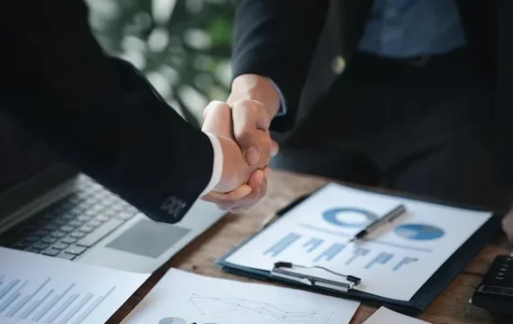 business-investor-group-holding-hands-two-businessmen-are-agreeing-business-together-shaking-hands-after-successful-negotiation-handshaking-is-western-greeting-congratulation_